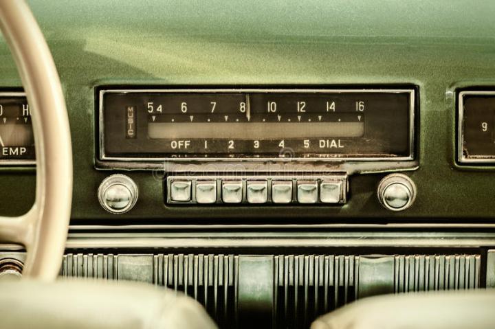retro-styled-image-old-car-radio-inside-green-classic-52458889