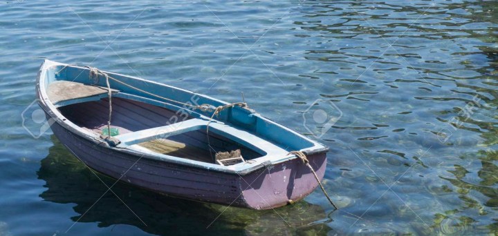 Small rustic rowing fishing boat